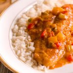 crawfish etouffe topped with catfish fillet