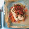 catfish papillote on bed of vegetables and topped with tomatoes