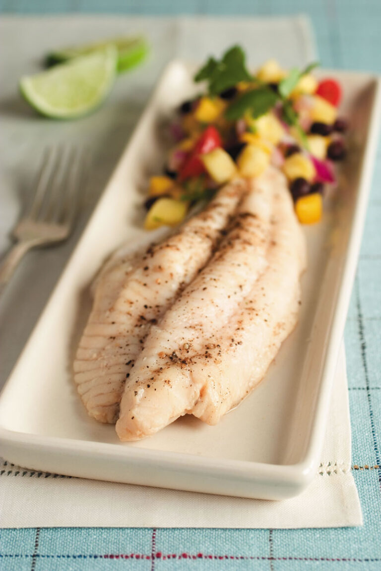 poached catfish with side of vegetables