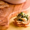 catfish spinach dip on top of parmesan crackers