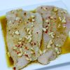 catfish fillets marinated in oil, garlic and pepper