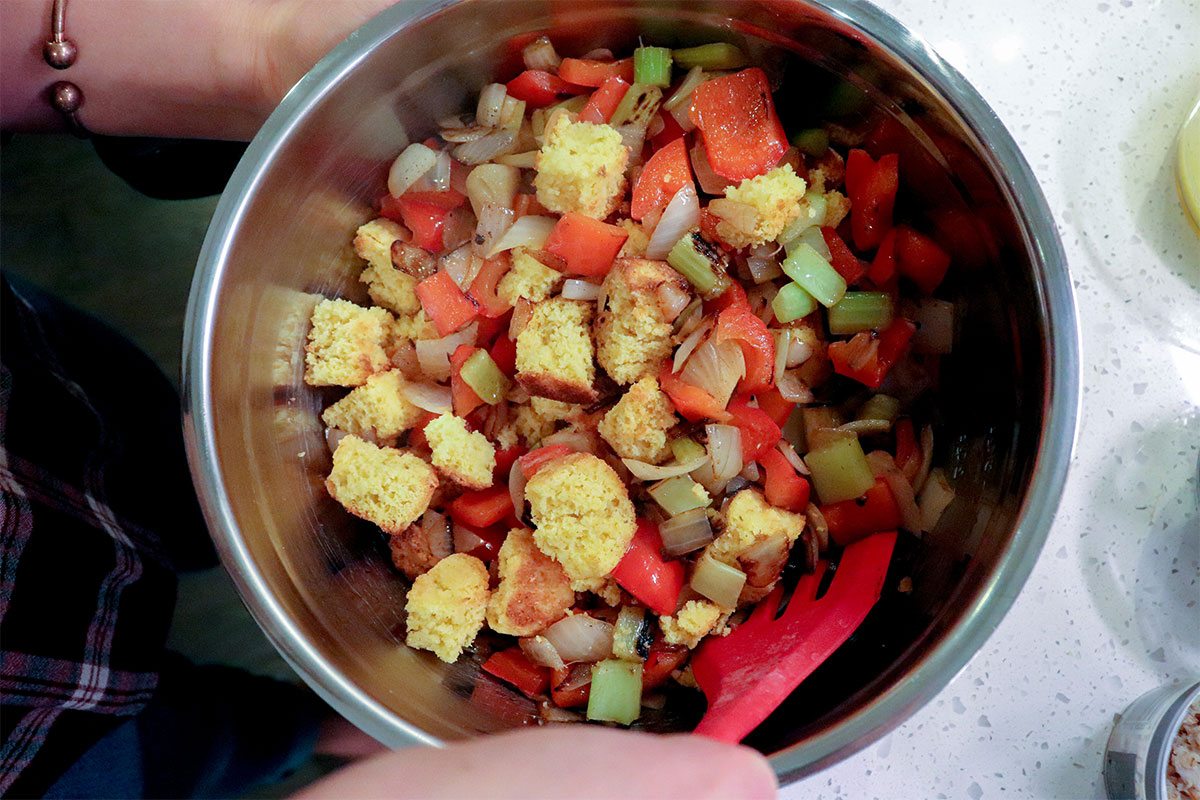 catfish cornbread dressing ingredients mixed in a bowl