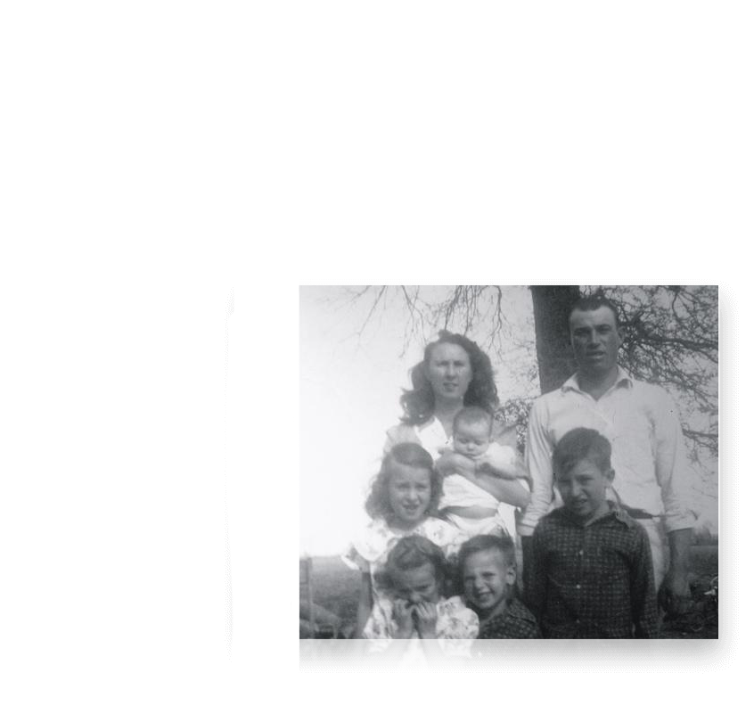 Black and white photo of Tackett family - parents and five children