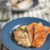 Blackened Catfish with mashed potatoes on a blue plate