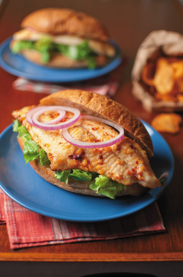 chipotle catfish sandwich with lettuce and onions
