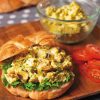 curry catfish salad on croissant with lettuce and tomato