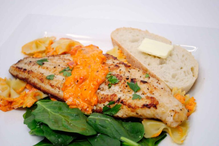 pan fried catfish with roasted red pepper sauce, spinach, pasta and bread