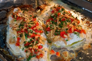 catfish topped with ingredients baking in oven