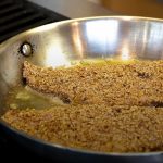 pecan crusted fillets cooking on stovetop