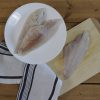 Raw Catfish on plate and cedar plank