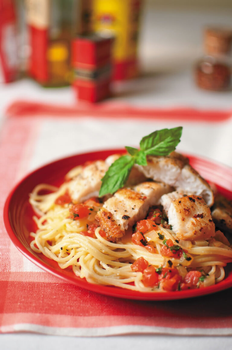 Lemon catfish pasta in red dish
