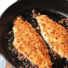 Onion Crusted Catfish cooking in cast iron skillet