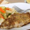 seasoned catfish fillet with side of veggies