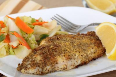 seasoned catfish fillet with side of veggies