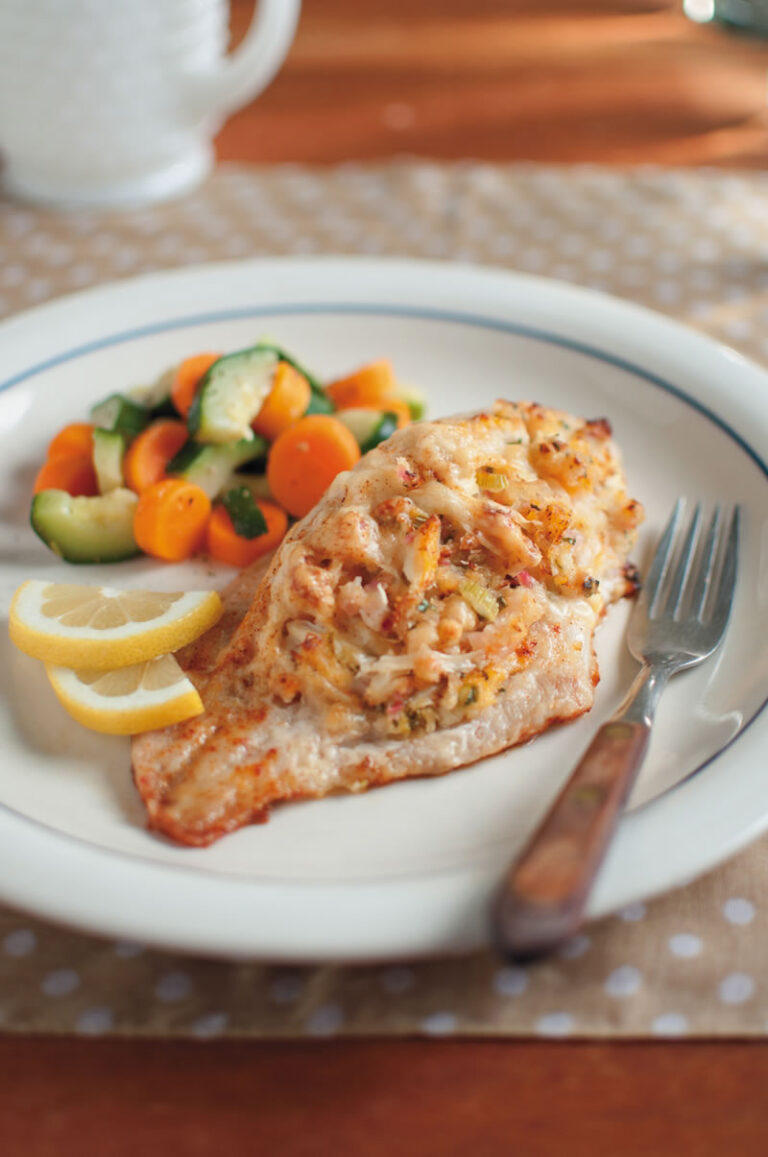 Seafood Stuffed Catfish with veggies on a plate