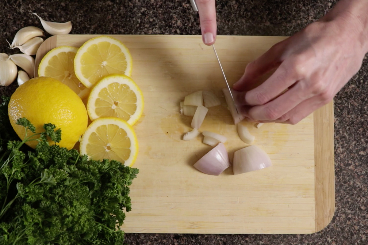 chopping onions for lemon pepper catfish recipe