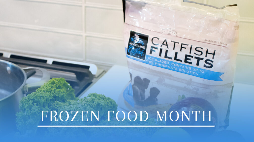 Close-up of a bag of Heartland Catfish Fillets on a counter with kale and other produce, with text reading "Frozen Food Month."