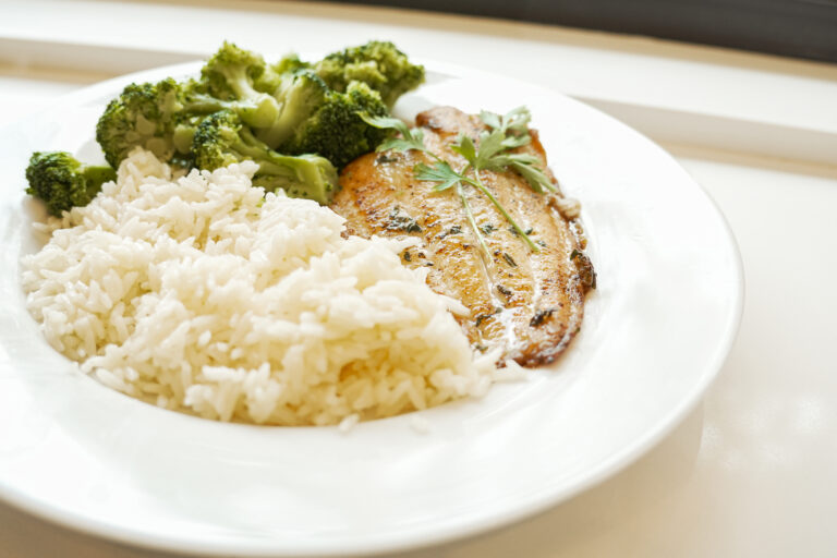 Grilled catfish with rice and broccoli.