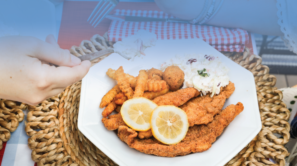 Fried catfish with fries and hushpuppies.