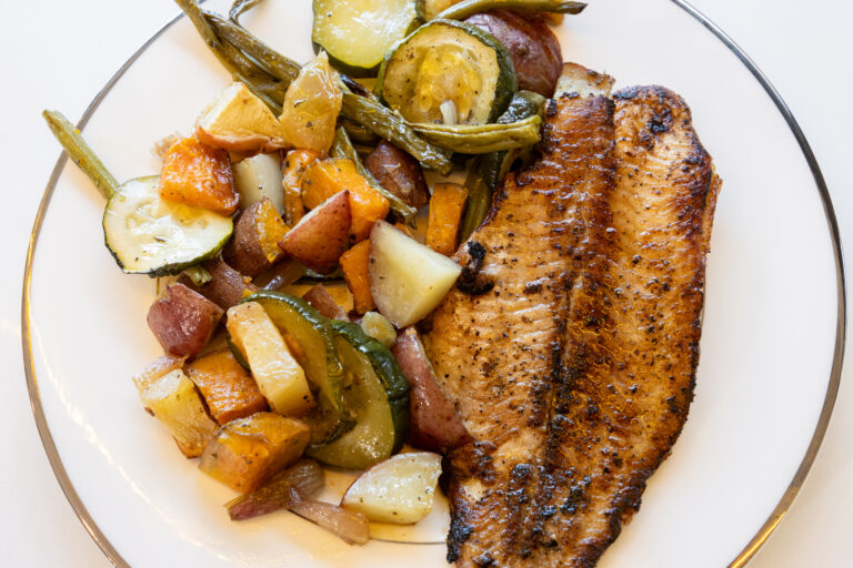 Grilled catfish with side of steamed vegetables.
