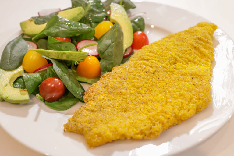 Fried catfish with side salad.