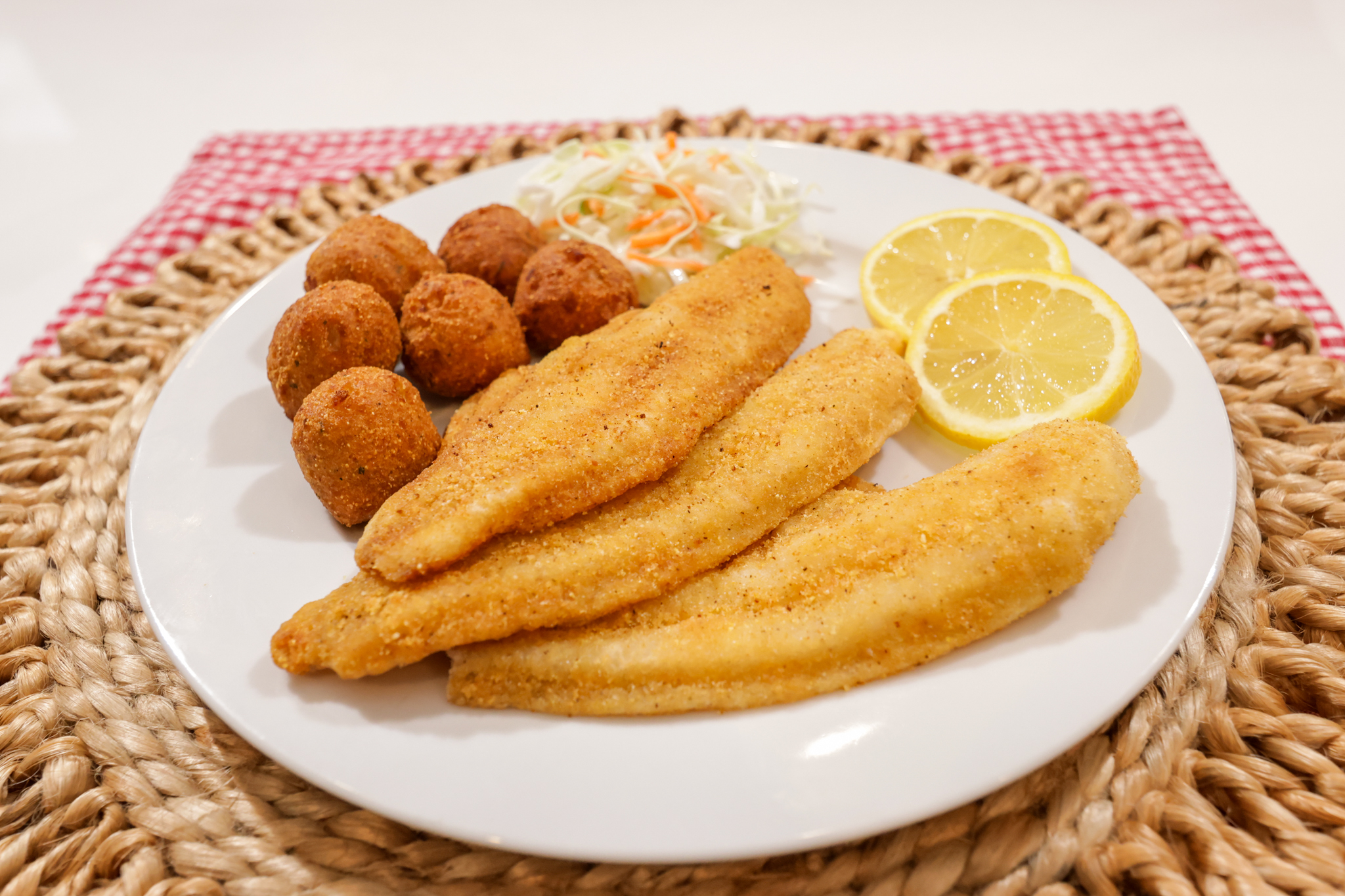 Plate of fried catfish and hushpuppies.